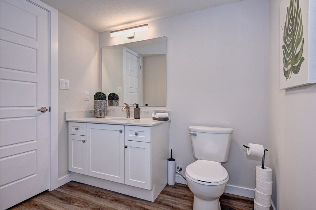 an empty bathroom with a toilet and a sink
