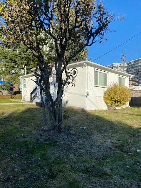 a small house with a tree in front of it