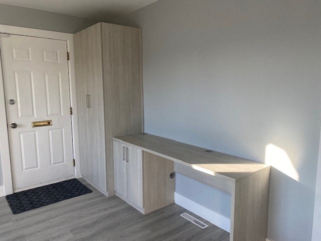 an empty room with a desk and a door