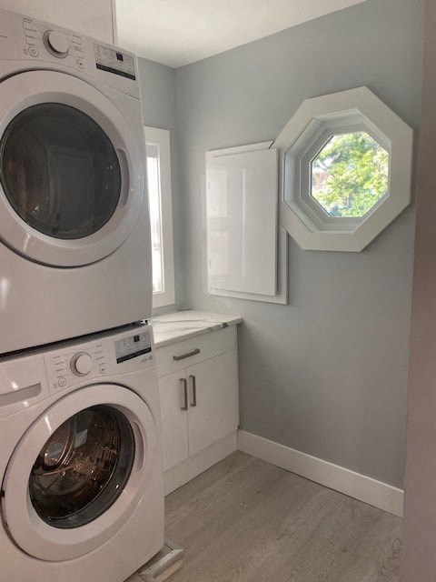 a laundry room with a washing machine and a window