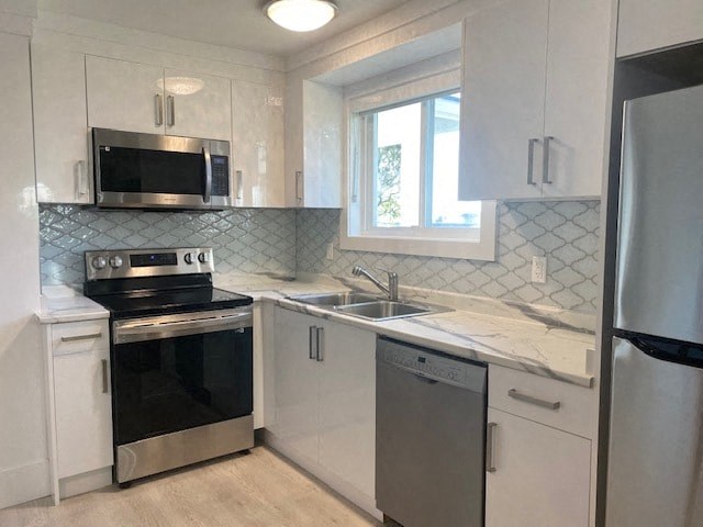 a small kitchen with a stove and a sink