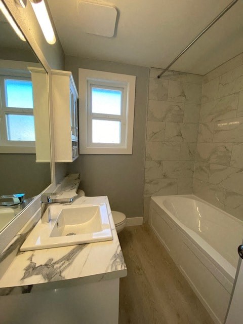 a bathroom with a sink and a bath tub