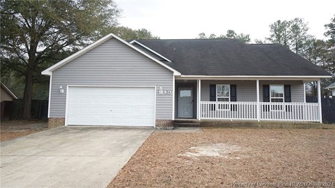 a blue house with a white garage door