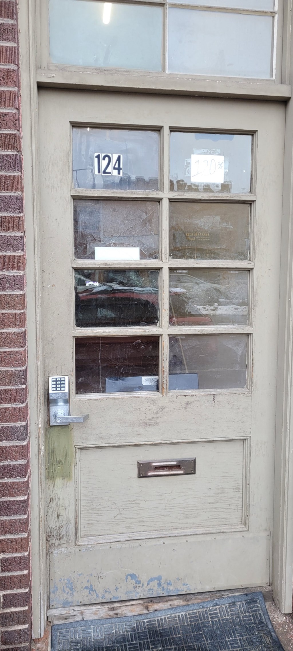 the front door of a building with a number 124 on it