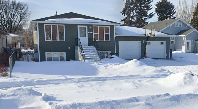 a house with snow in front of it