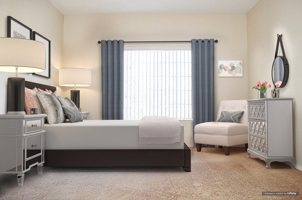 a bedroom with a bed and a dresser and a window