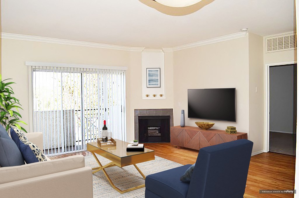a living room with a couch and a tv and a fireplace