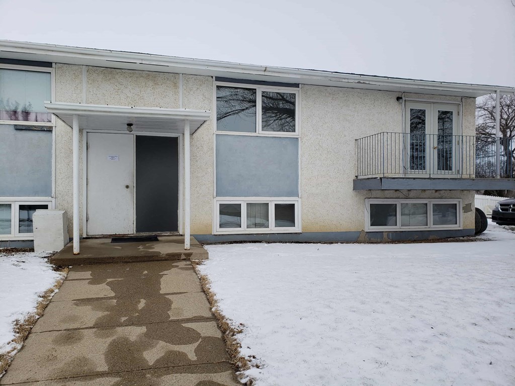 the front of a house in the snow