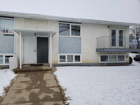 the front of a house in the snow