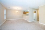 an empty living room and kitchen in a house