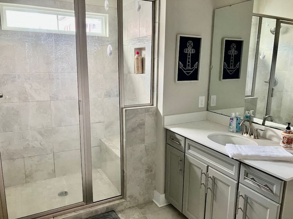 a bathroom with a sink and a shower