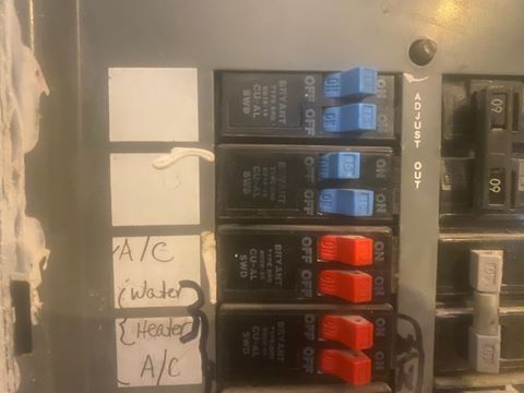 a close up of an electrical surge protector with labels on it