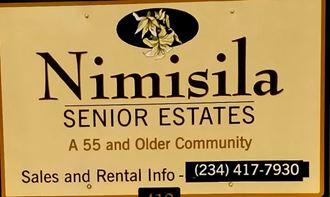 a sign that says senior estates sales and older community