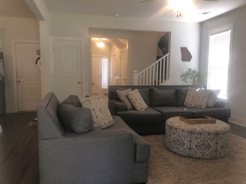 a living room with a couch and a table