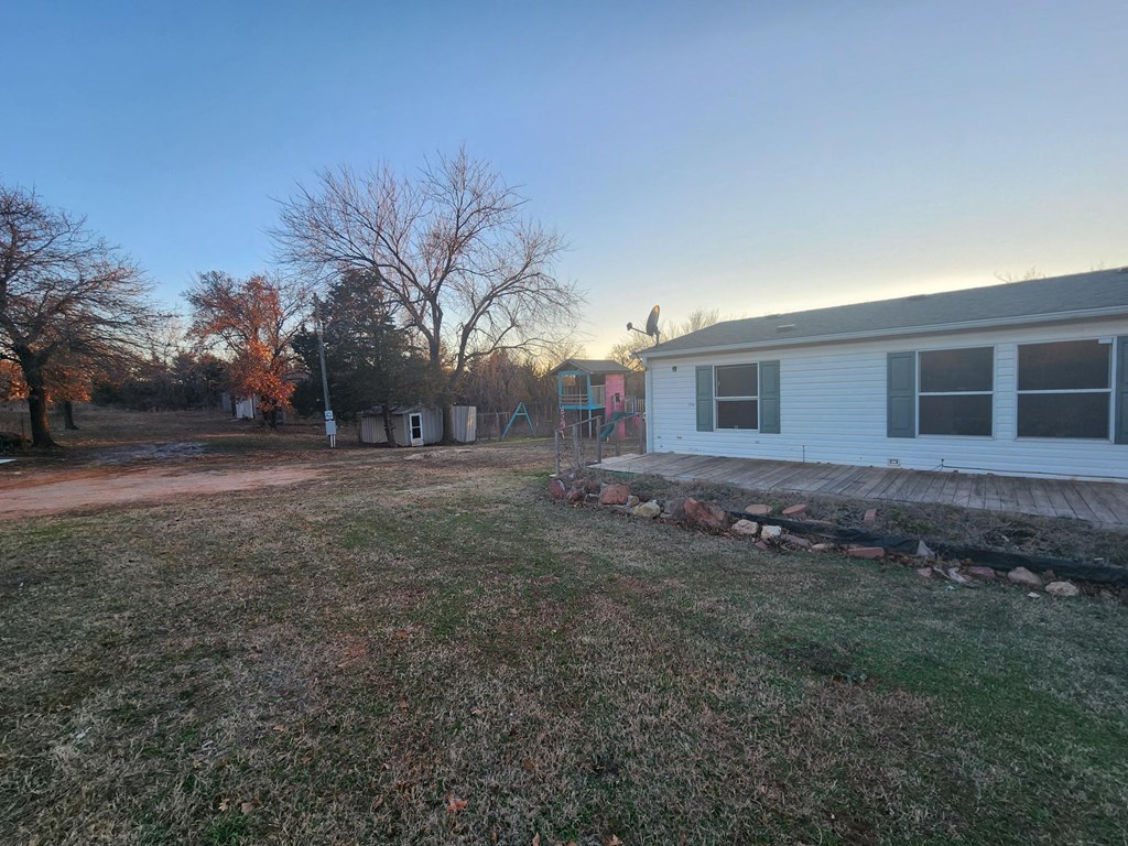 a view of the backyard from the back of the house