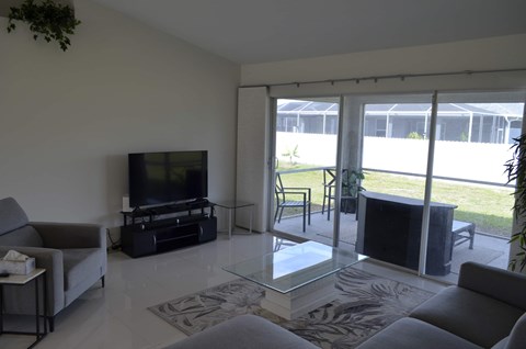 a living room with a couch and a television