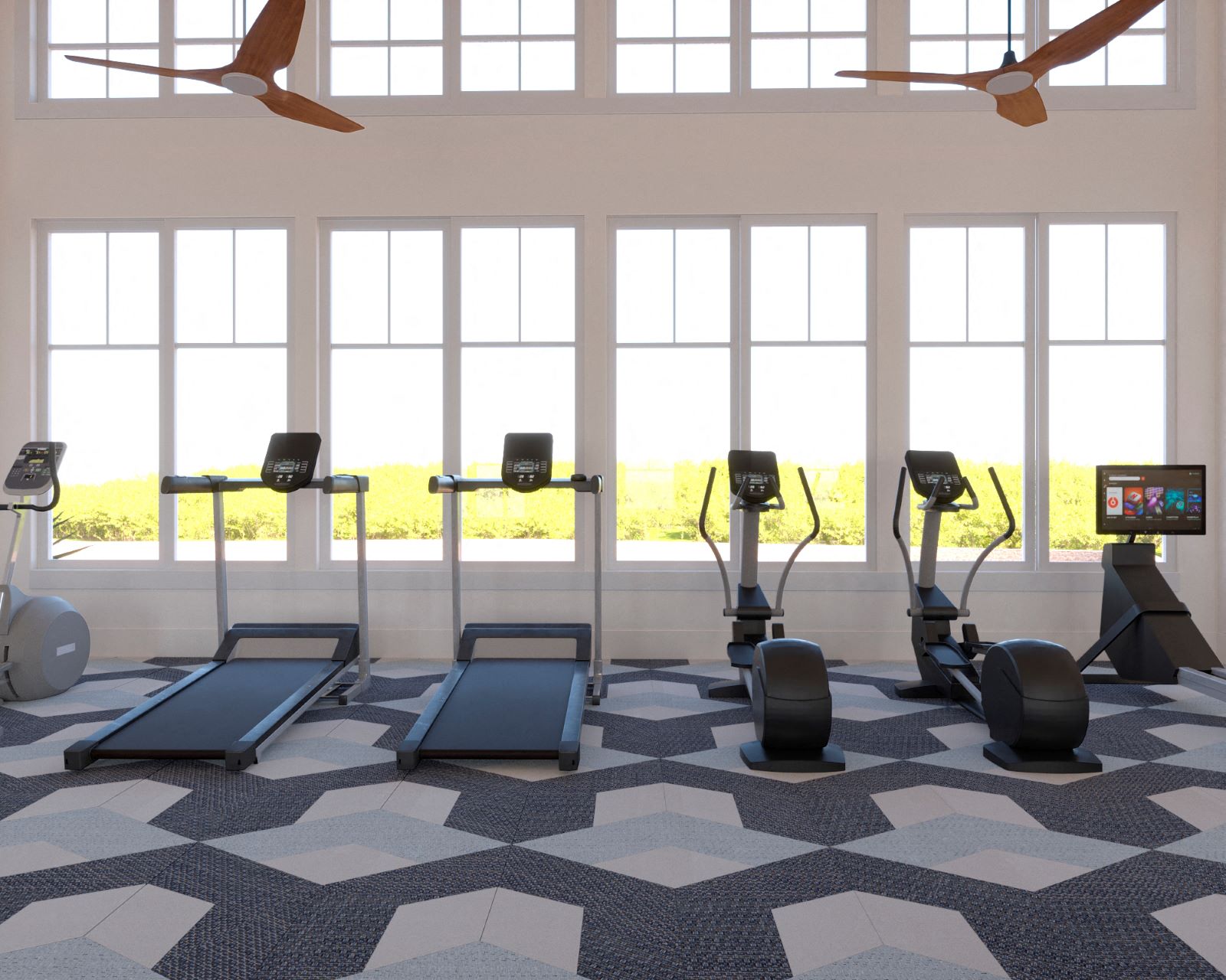 a gym with treadmills and weights in a room with windows