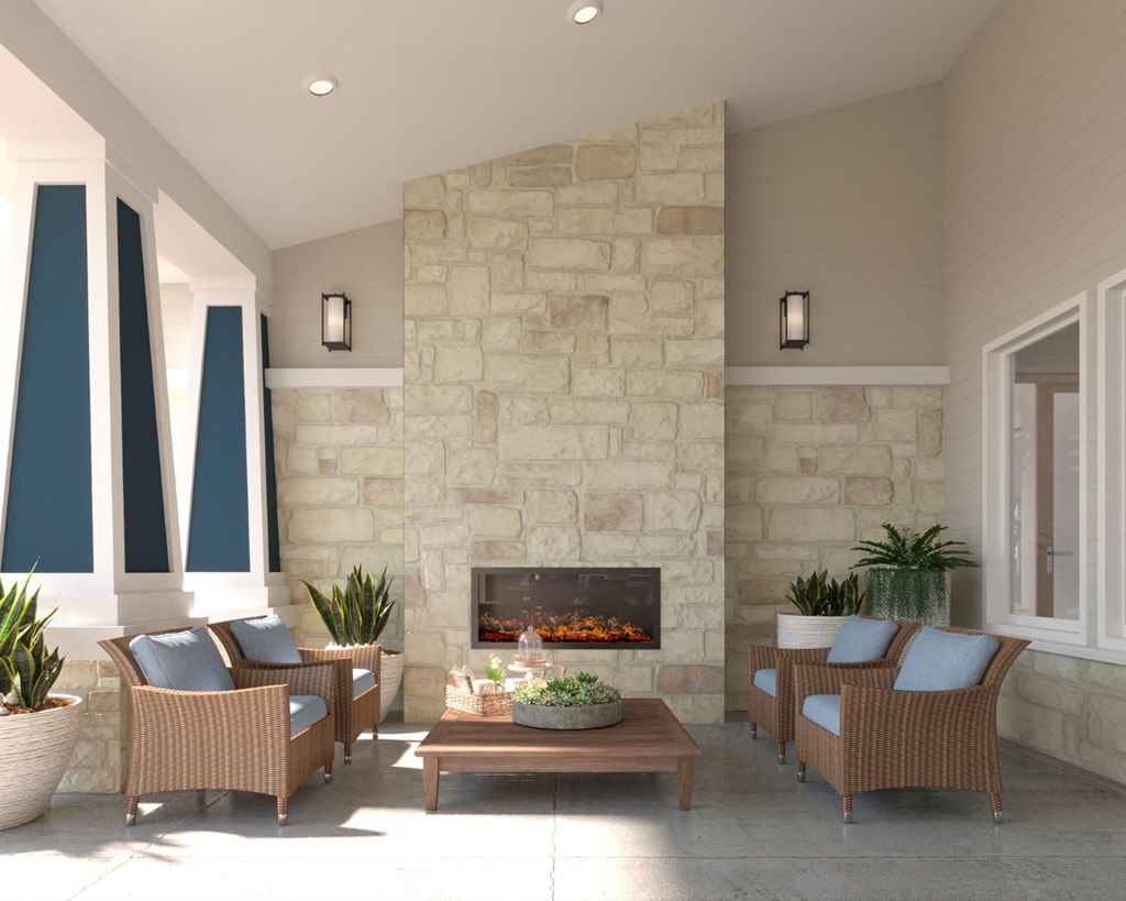 a living room with a fireplace and chairs