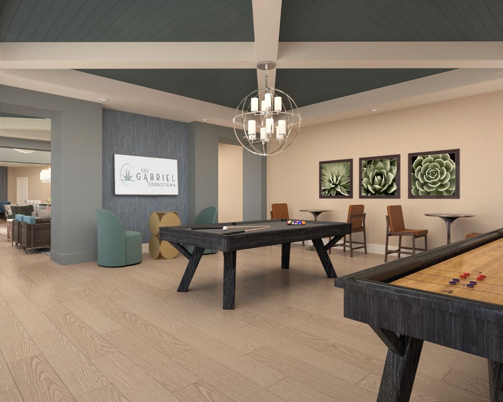 a spacious game room with a pool table and tables