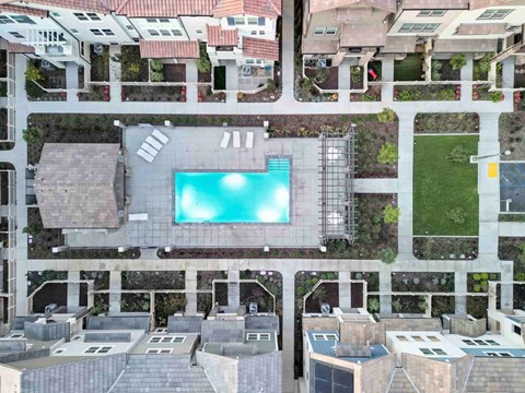 a swimming pool in the middle of a building with other apartments