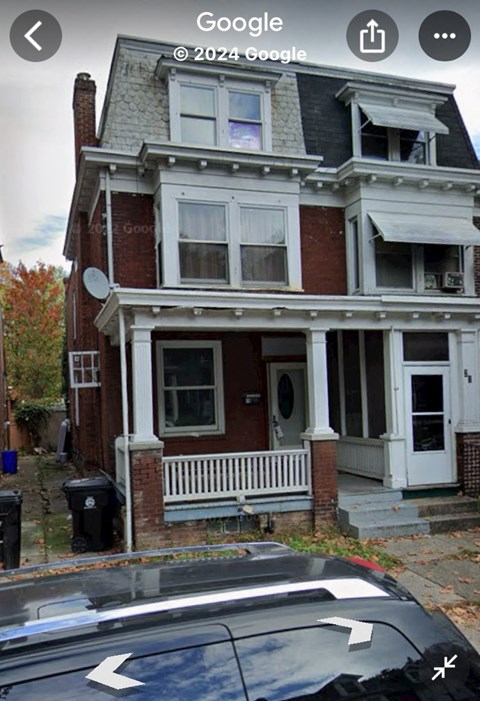 a house with a car parked in front of it