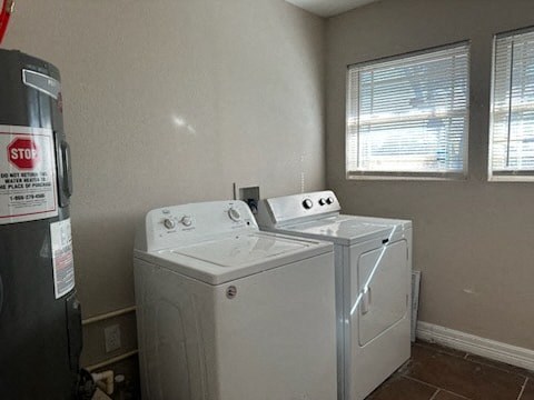 a laundry room with two washing machines and a refrigerator