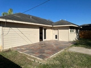 a small house with a patio in front of it