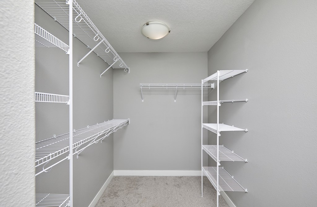 Empty white shelving unit in a room.