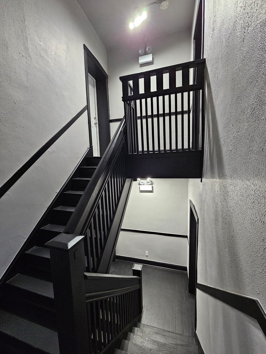 the stairs to the second floor of the building are empty