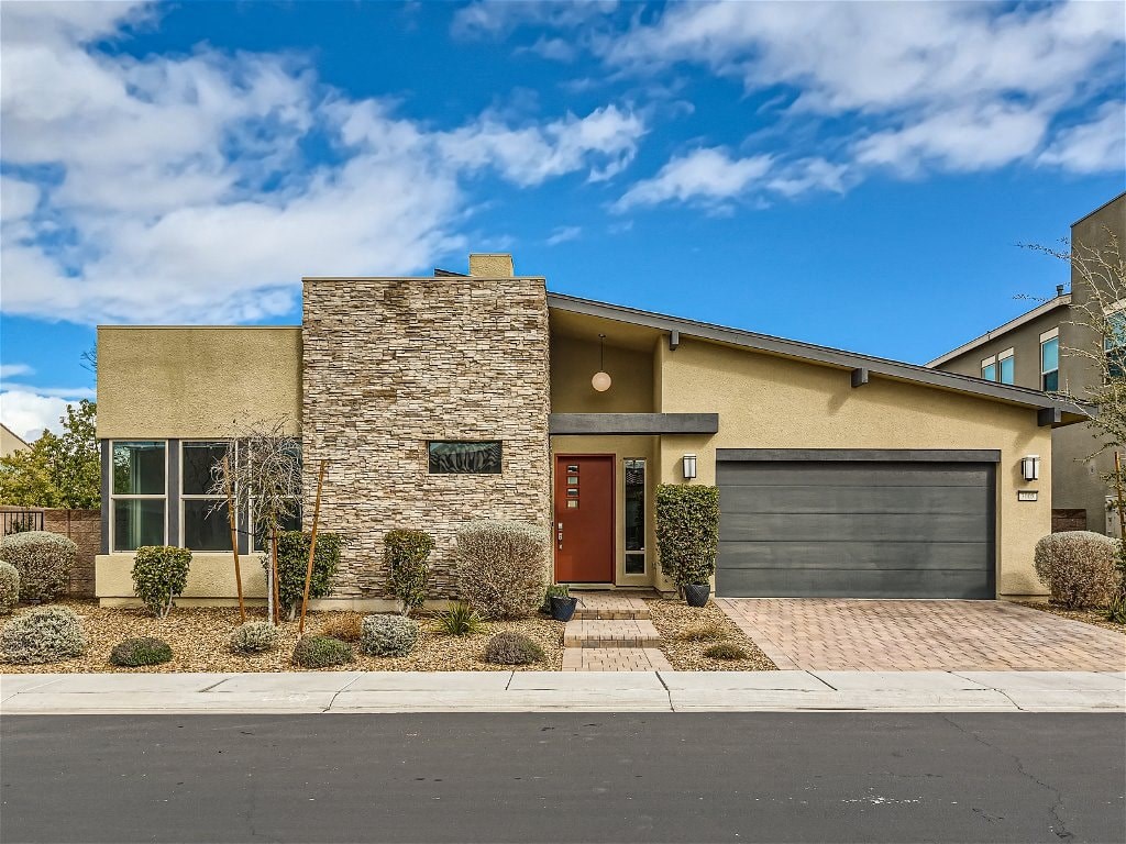 a house with a driveway and a garage door