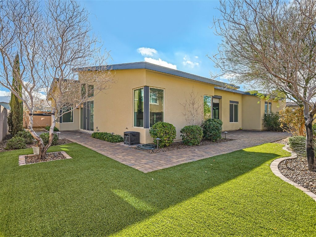 a house with a yard and a lawn and trees
