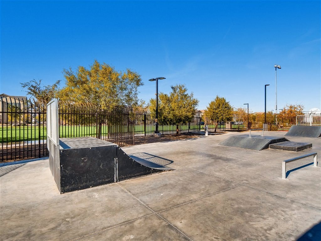 a skate park with skate ramps and benches