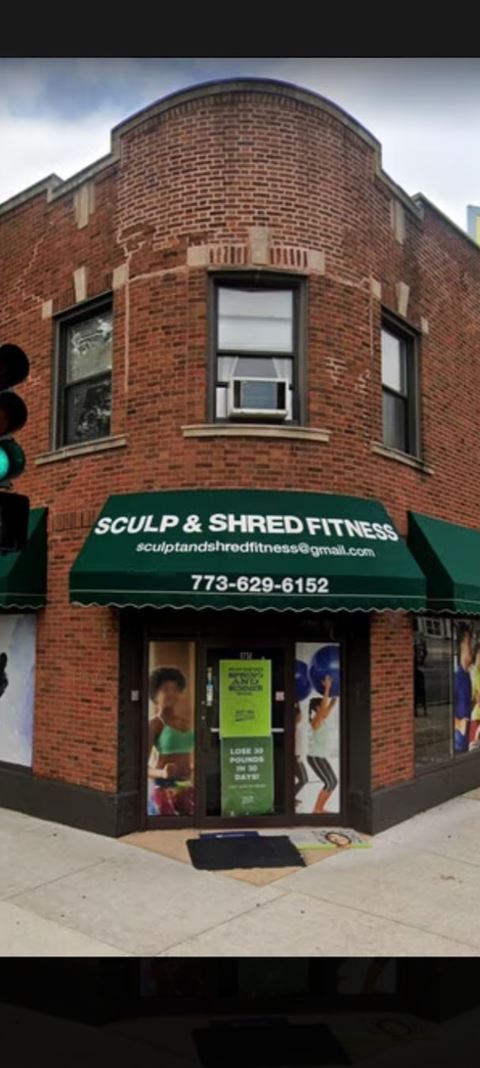 a building with a green awning on the front of it