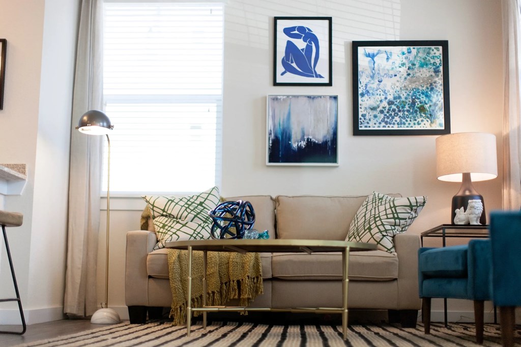 a living room with a couch and a table