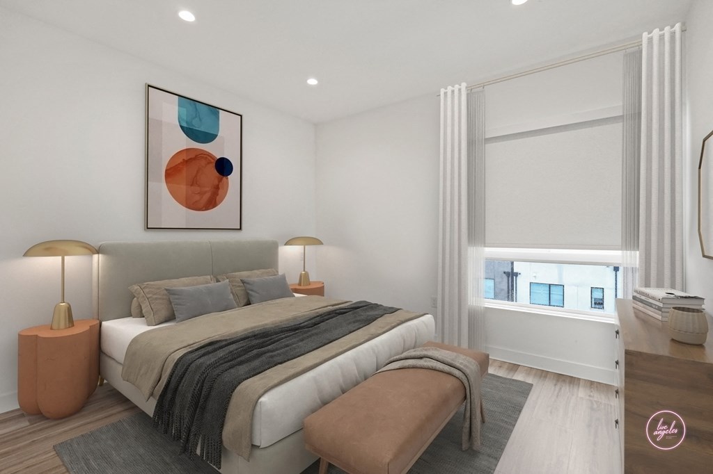 a bedroom with a bed and a window