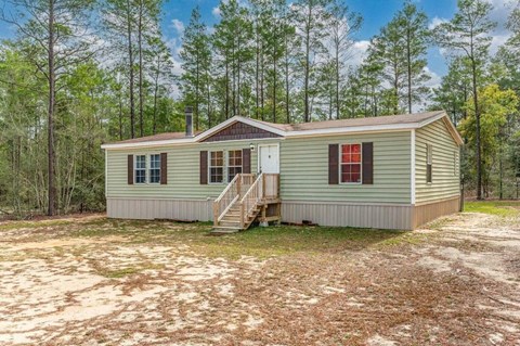 a small house in the middle of the woods