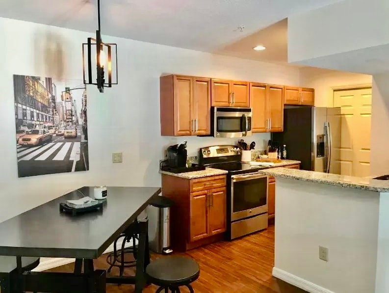 a kitchen with wooden cabinets and a counter top