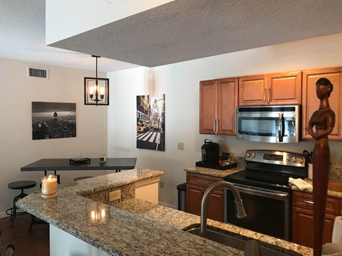 a kitchen with a granite counter top and a sink