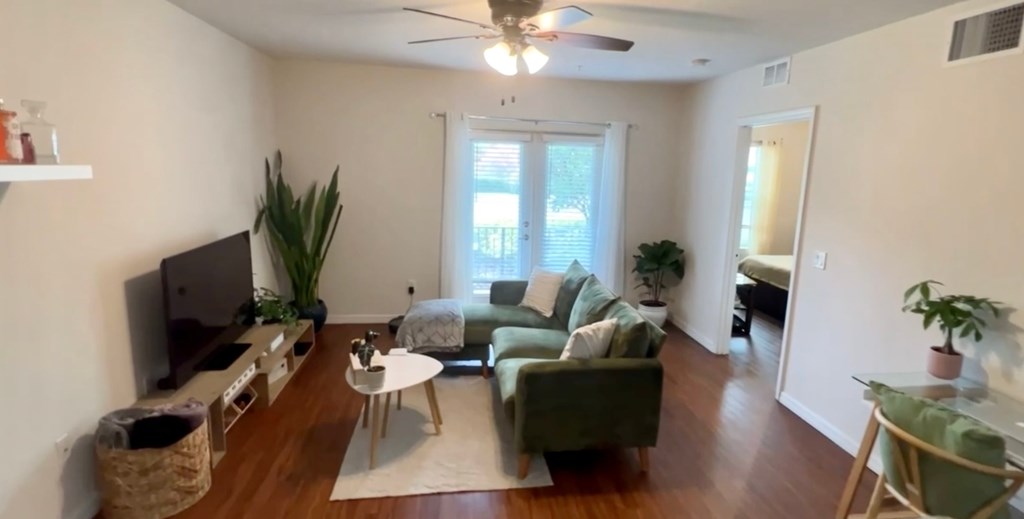 a living room with a couch and a tv