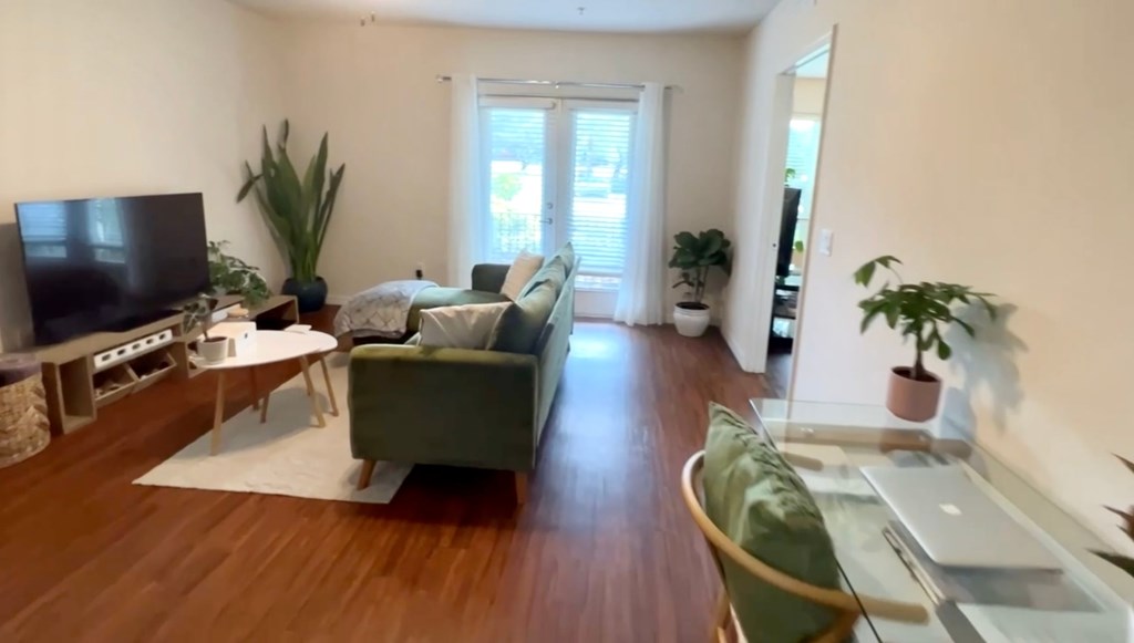 a living room with a couch and a tv