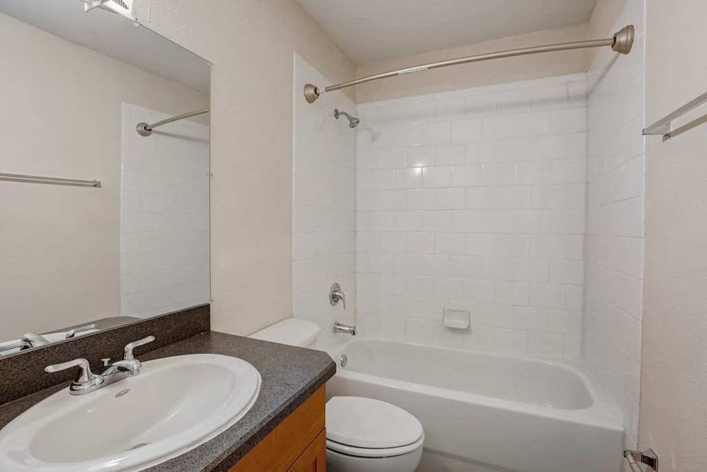 a bathroom with a sink toilet and a tub