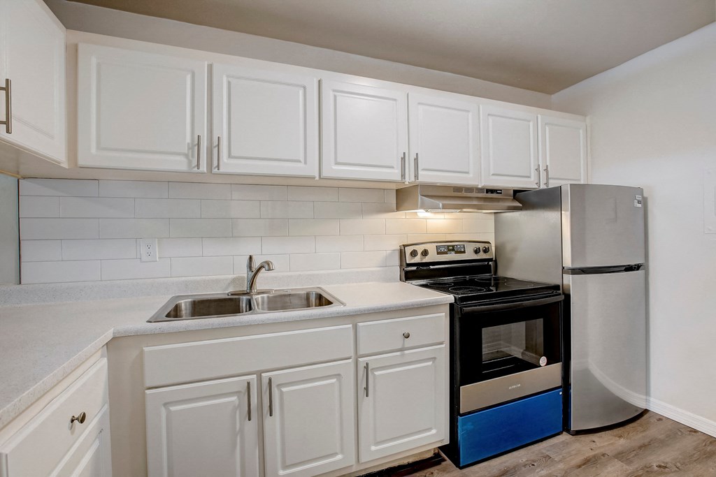 the preserve at ballantyne commons apartment kitchen with stove refrigerator and sink