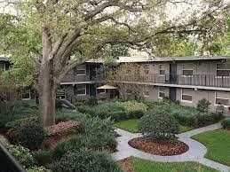 an apartment building with a garden in the middle