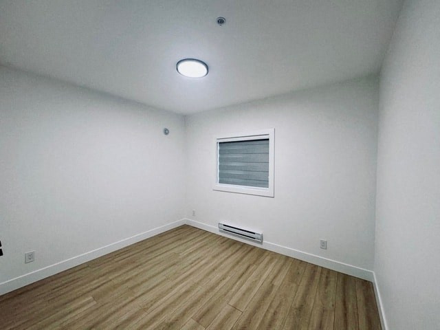 an empty room with white walls and a window