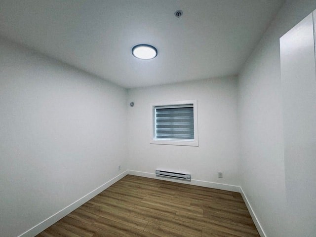 a empty room with white walls and a window