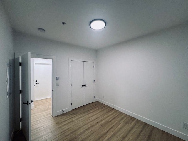 an empty room with white walls and a white door