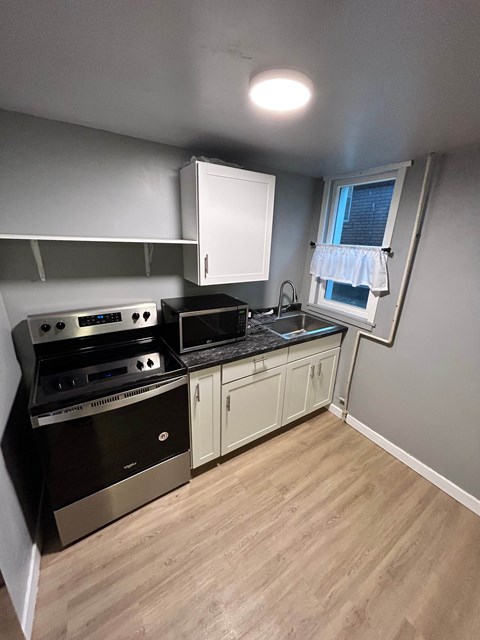 A kitchen with a stove and oven.