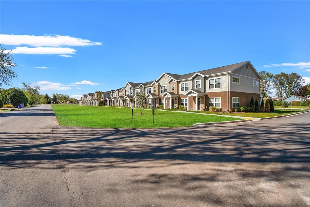 Newly-built section of Muskego School Apartments with large green lawns