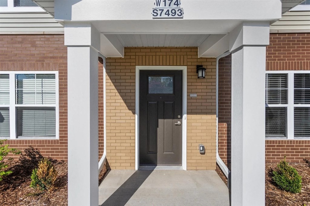 Individual portico entrances at Muskego School Apartments for seniors in Muskego, WI