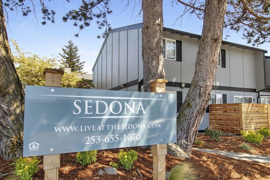 a sign in front of a house
